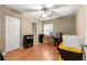 Bright bedroom with wood floors and a ceiling fan, ready for personal touches at 43 Almond Pass Dr, Ocala, FL 34472