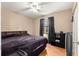 Comfortable bedroom with wood flooring and a large window for natural light at 43 Almond Pass Dr, Ocala, FL 34472