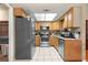 Functional kitchen featuring stainless steel appliances and light wood cabinetry at 43 Almond Pass Dr, Ocala, FL 34472