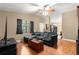 Cozy living room with neutral tones, wood floors, and a comfortable seating area at 43 Almond Pass Dr, Ocala, FL 34472