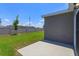 Spacious backyard with a concrete patio and a view of the neighboring houses at 532 Silver Palm Dr, Haines City, FL 33844