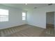 Bright bedroom featuring carpeted flooring and large windows, providing ample natural light at 532 Silver Palm Dr, Haines City, FL 33844