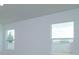 Bright bedroom with large windows, offering a clear view of the lush outdoor scenery at 532 Silver Palm Dr, Haines City, FL 33844