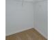 A carpeted walk-in closet features white walls, base trim, and shelving at 532 Silver Palm Dr, Haines City, FL 33844