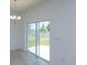 Dining area with tile flooring and sliding glass doors, providing seamless access to the outdoor space at 532 Silver Palm Dr, Haines City, FL 33844
