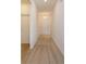 Inviting hallway with carpet flooring leading to the front door, creating a warm and welcoming ambiance at 532 Silver Palm Dr, Haines City, FL 33844