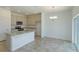 Well-lit kitchen featuring stainless steel appliances and a center island, perfect for cooking and dining at 532 Silver Palm Dr, Haines City, FL 33844
