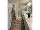 Bright bathroom offers double sinks, modern fixtures, and a glass-enclosed shower at 5547 Se 91St Pl, Ocala, FL 34480