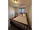 Comfortable bedroom featuring a classic bed frame, plush carpet, and a window for natural light at 5547 Se 91St Pl, Ocala, FL 34480