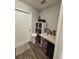 Functional laundry area with a storage cabinet, countertop, and door to the exterior at 5547 Se 91St Pl, Ocala, FL 34480