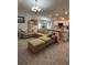 Spacious living room boasts open layout with adjacent kitchen, creating a seamless flow for modern living and entertaining at 5547 Se 91St Pl, Ocala, FL 34480