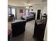 Spacious main bedroom boasts a ceiling fan, a large bed, and a walk-in closet for ample storage space at 5547 Se 91St Pl, Ocala, FL 34480