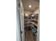 Well-organized pantry with ample shelving, providing plenty of storage space for all your kitchen essentials and groceries at 5547 Se 91St Pl, Ocala, FL 34480