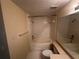 Bathroom with tub, shower, toilet, and vanity with a large framed mirror at 5560 Metrowest Blvd # 3-204, Orlando, FL 32811