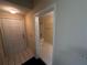 Bathroom view featuring light and bright neutral colors and a white door at 5560 Metrowest Blvd # 3-204, Orlando, FL 32811