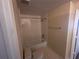 Cozy bathroom featuring a tiled shower/tub combo with white fixtures at 5560 Metrowest Blvd # 3-204, Orlando, FL 32811