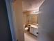Cozy bathroom with a shower and bath combo, toilet, vanity, and sink at 5560 Metrowest Blvd # 3-204, Orlando, FL 32811