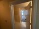 Bedroom view featuring neutral tones, carpet, and views to the balcony at 5560 Metrowest Blvd # 3-204, Orlando, FL 32811