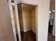 Bedroom closet with mirrored sliding doors, shelving, and a carpeted floor at 5560 Metrowest Blvd # 3-204, Orlando, FL 32811