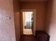 Condo entryway featuring neutral tones, tiled floors and views into the living room at 5560 Metrowest Blvd # 3-204, Orlando, FL 32811