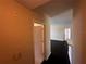 Inviting entryway featuring dark wood floors and neutral walls, leading to a bright living space at 5560 Metrowest Blvd # 3-204, Orlando, FL 32811