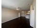 Open living space featuring wood floors, kitchen, and natural light at 5560 Metrowest Blvd # 3-204, Orlando, FL 32811