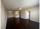 Open living space featuring wood floors, kitchen, and natural light at 5560 Metrowest Blvd # 3-204, Orlando, FL 32811