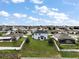 Aerial view of the backyard and neighborhood showcasing location, privacy, and community layout at 605 Black Eagle Dr, Groveland, FL 34736