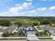 Aerial shot of home featuring manicured lawn and neighborhood layout at 605 Black Eagle Dr, Groveland, FL 34736