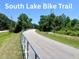 Scenic bike trail winding through lush greenery, perfect for outdoor recreation and exercise at 605 Black Eagle Dr, Groveland, FL 34736