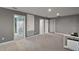 Large bonus room with multiple doorways and carpeted floors, perfect for recreation and entertainment at 605 Black Eagle Dr, Groveland, FL 34736