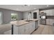 Well appointed kitchen featuring a large island with lots of counter space, seating, and storage at 605 Black Eagle Dr, Groveland, FL 34736