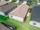 This house features a well-maintained lawn, a neutral-colored roof, and a bright white exterior at 6301 Whittle Ct, The Villages, FL 32163