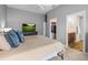 Spacious bedroom with en-suite bathroom and walk-in closet, offering convenience and privacy at 6301 Whittle Ct, The Villages, FL 32163
