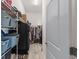 Walk-in closet with ample storage space with installed shelving, drawers, and rods at 6301 Whittle Ct, The Villages, FL 32163