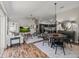 Bright open concept living area with luxury vinyl floors open to dining area and kitchen at 6301 Whittle Ct, The Villages, FL 32163