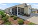 This single-story home features a spacious screened porch and well-manicured, low-maintenance landscaping at 6301 Whittle Ct, The Villages, FL 32163