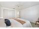 Bright bedroom with white walls, ceiling fan, closet and neutral carpet at 654 Fayette Ct, The Villages, FL 32162