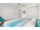 Cozy bedroom with beach-themed wall art, ample closet space and bright interior at 654 Fayette Ct, The Villages, FL 32162