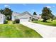 Well-maintained single story home with a two car garage and mature landscaping at 654 Fayette Ct, The Villages, FL 32162