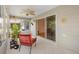 Relaxing sunroom with tiled floors, ceiling fan, and sliding door access at 654 Fayette Ct, The Villages, FL 32162