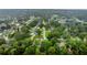 Aerial view of neighborhood filled with mature trees and well maintained roads at 717 Southeast 46Th Ct, Ocala, FL 34471