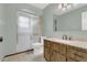 Bathroom with a single sink vanity, tile floors, and a shower behind sliding glass doors at 717 Southeast 46Th Ct, Ocala, FL 34471