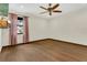 Bedroom features ceiling fan, hardwood floors, natural light and an exterior view at 717 Southeast 46Th Ct, Ocala, FL 34471