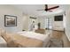 Spacious bedroom featuring luxury vinyl flooring and sliding doors to the pool area at 717 Southeast 46Th Ct, Ocala, FL 34471
