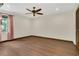Bedroom features ceiling fan, hardwood floors, and natural light at 717 Southeast 46Th Ct, Ocala, FL 34471