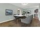 Formal dining room featuring luxury vinyl flooring and a decorative ceiling medallion at 717 Southeast 46Th Ct, Ocala, FL 34471