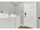 Functional laundry room with washer, dryer, and door to outside or garage at 717 Southeast 46Th Ct, Ocala, FL 34471