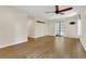 Spacious living room with beautiful hardwood floors and sliding door access at 717 Southeast 46Th Ct, Ocala, FL 34471