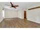 Inviting living room features hardwood floors, ceiling fan, and natural light at 717 Southeast 46Th Ct, Ocala, FL 34471